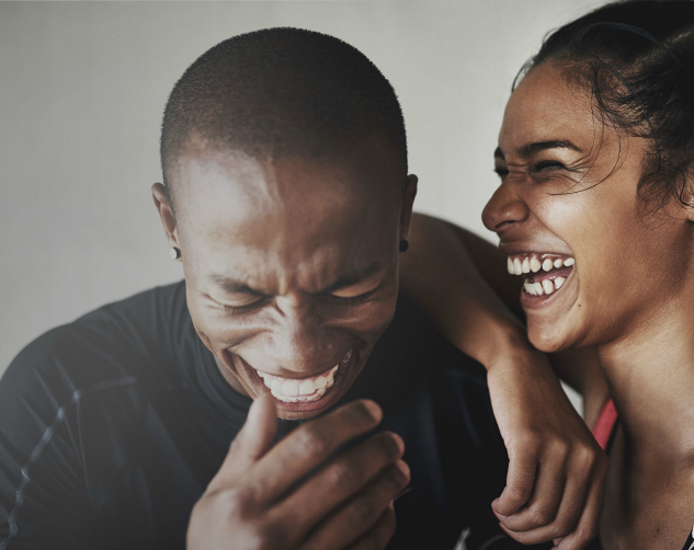 two people laughing smiling, health intimate partner violence