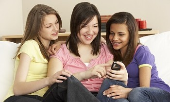 teen girls using cellphone