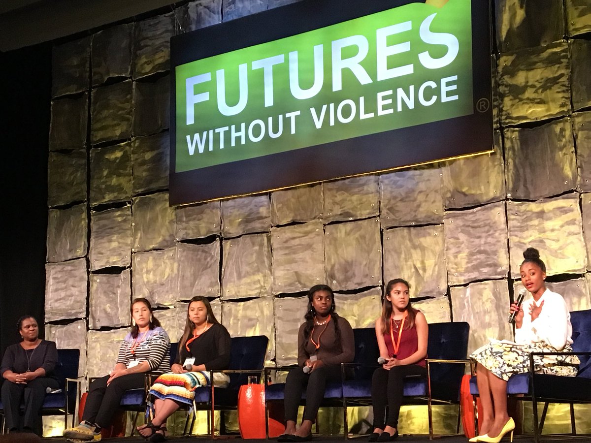panel of youth speaking at conference